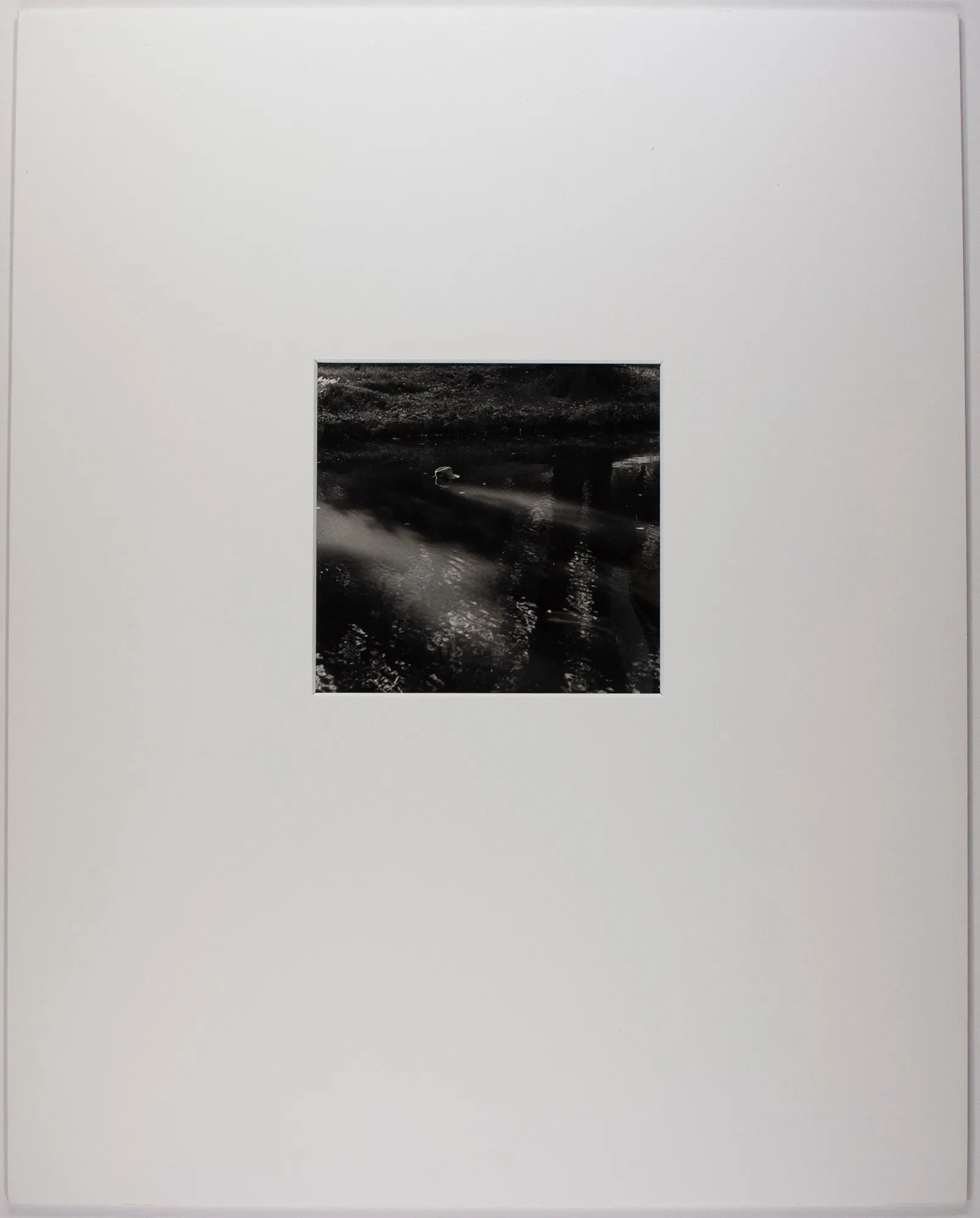 Man's Hat in River - II